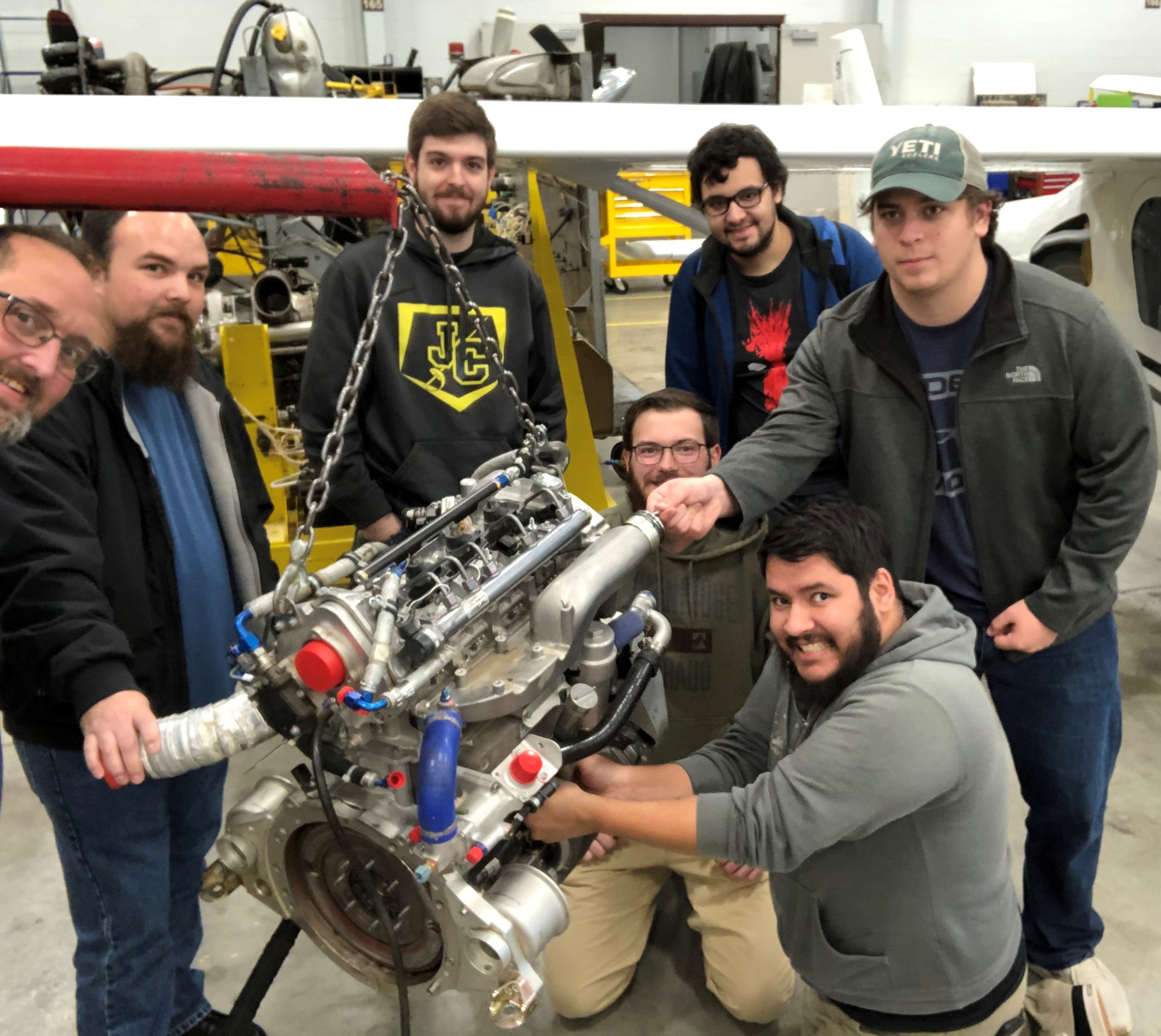 K-State students work on a Heavy Fuel Engine donated by GA-ASI. 